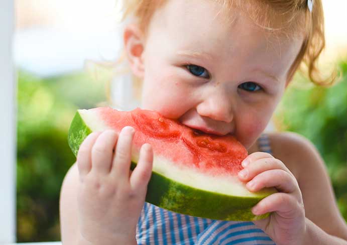  girl eats watermelon